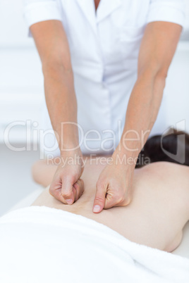 Physiotherapist doing back massage