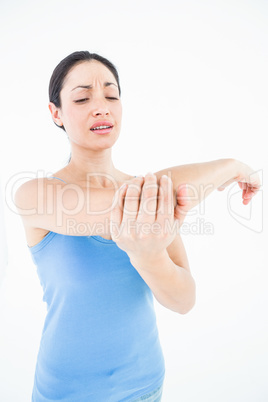 Pretty woman suffering from elbow pain