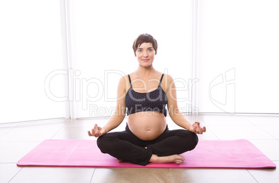 Pregnant woman keeping in shape