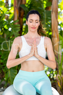 Smiling woman doing yoga