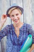 Pretty blonde woman holding folders