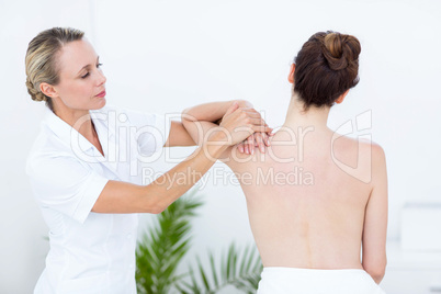 Physiotherapist doing shoulder massage