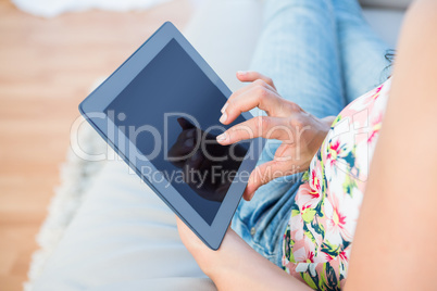 Woman fingers touching tablet