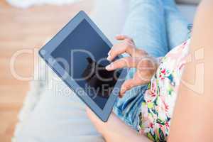 Woman fingers touching tablet