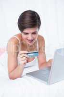 Happy woman doing online shopping