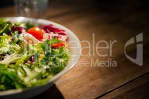 Healthy salad and glass of water