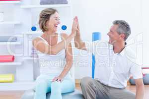 Doctor and patient smiling at each other