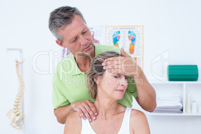 Doctor doing neck adjustment