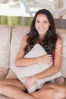 Pretty brunette relaxing on the couch