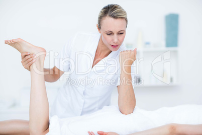 Physiotherapist doing foot massage