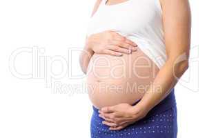 Pregnant woman holding her bump