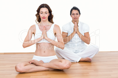 Women sitting in lotus pose