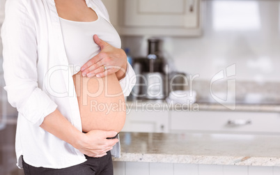 Pregnant woman holding her bump