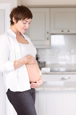 Pregnant woman holding her bump