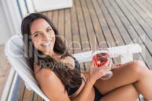 Beautiful woman relaxing and holding drink