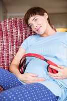 Pregnant woman relaxing on the couch