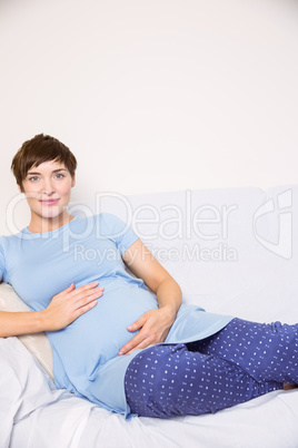 Pregnant woman relaxing on the couch