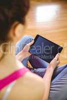 Casual woman using her tablet pc