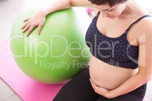 Pregnant woman keeping in shape