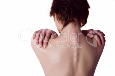 Nude woman with a shoulder injury