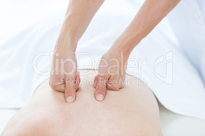 Physiotherapist doing back massage