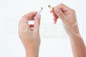 Close up of a woman breaking cigarette