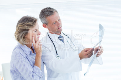 Doctor showing xray to his patient