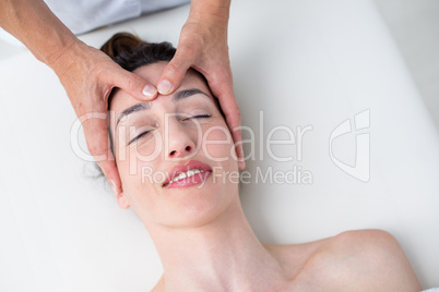 Physiotherapist doing head massage