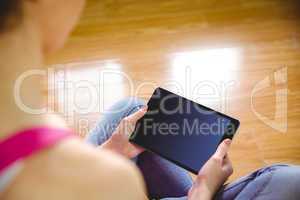 Casual woman using her tablet pc