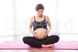 Pregnant woman keeping in shape