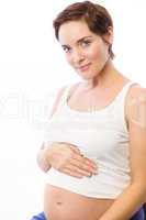 Pregnant woman smiling at camera