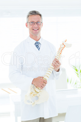 Doctor showing anatomical spine