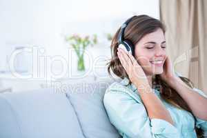 Peaceful woman listening music
