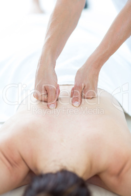 Physiotherapist doing back massage