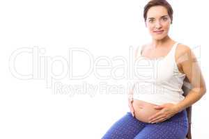 Pregnant woman smiling at camera