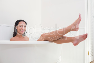 Pretty brunette taking a bath