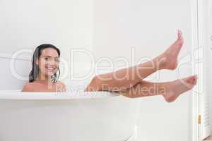 Pretty brunette taking a bath