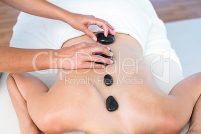 Woman getting hot stone massage