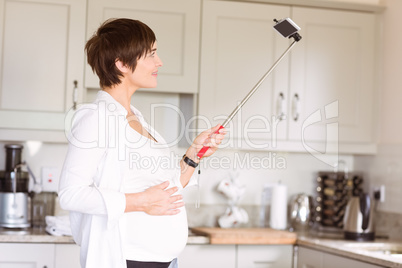 Pregnant woman taking a selfie