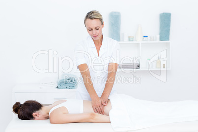 Physiotherapist doing back massage