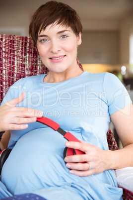 Pregnant woman relaxing on the couch