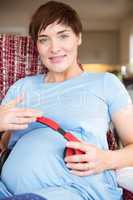 Pregnant woman relaxing on the couch