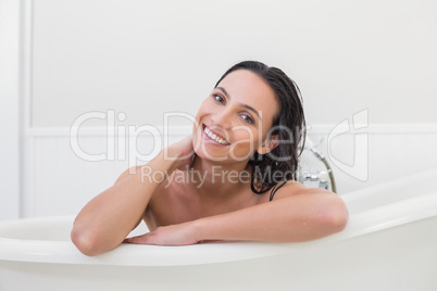 Pretty brunette taking a bath