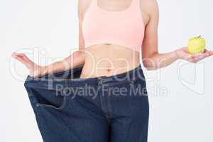 Woman showing her waist after losing weight