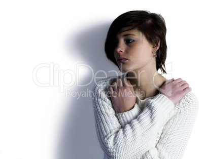 Sad pretty brunette thinking with arms crossed