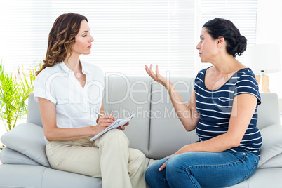 Depressed woman talking with her therapist