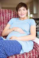 Pregnant woman relaxing on the couch