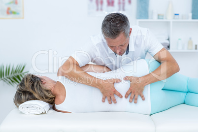 Doctor massaging his patient back