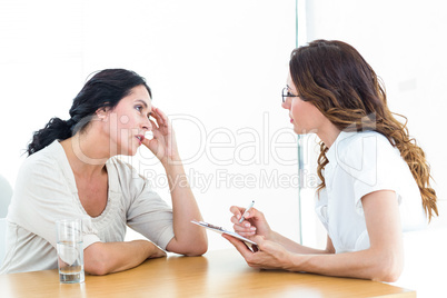 Depressed woman talking to her therapist