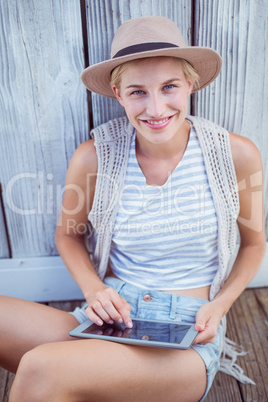 Pretty blonde woman using her tablet